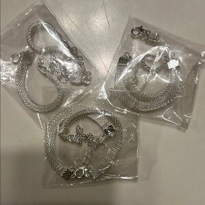 3 Silver Bracelets. Butterfly, Heart, and Bird charms.